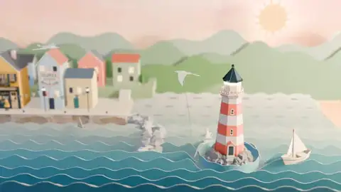 A striped paper lighthouse on a rocky islet beside a paper sailboat, with folded-paper houses along the quay at dawn